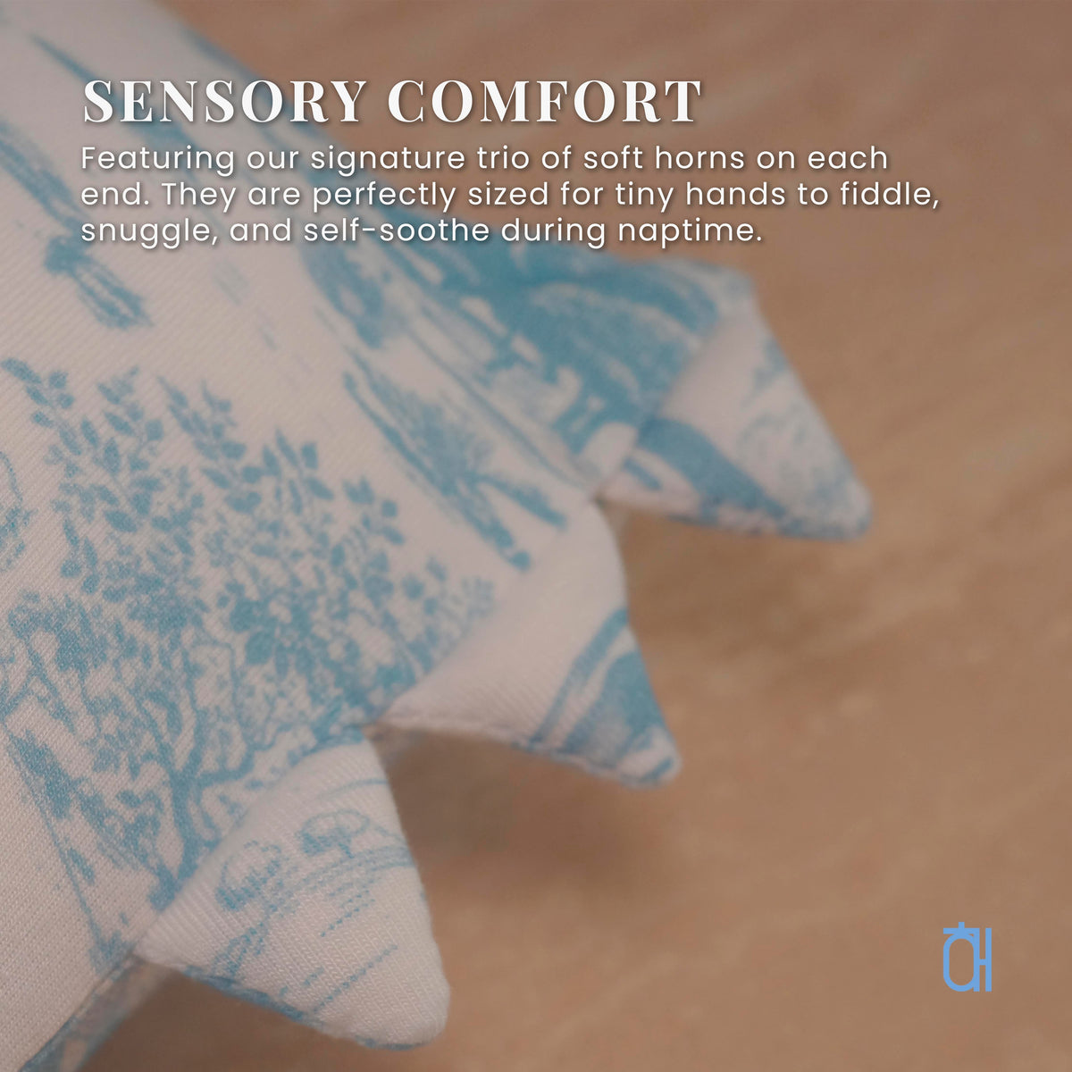 Open Meadows pillow detail — sensory triangle horns