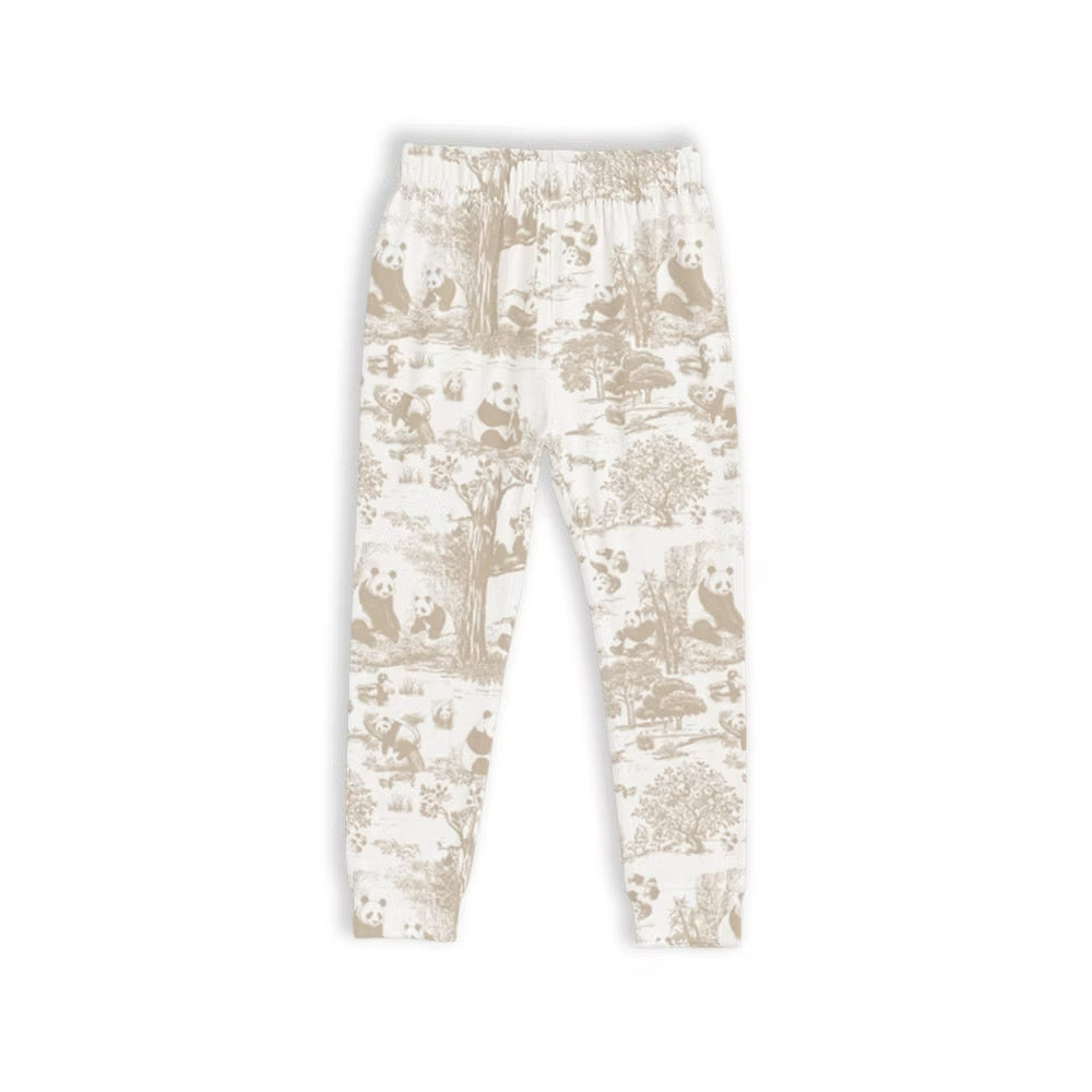 White bamboo kids pyjama pants with beige pattern on a white background — soft, breathable, eczema-friendly sleepwear.