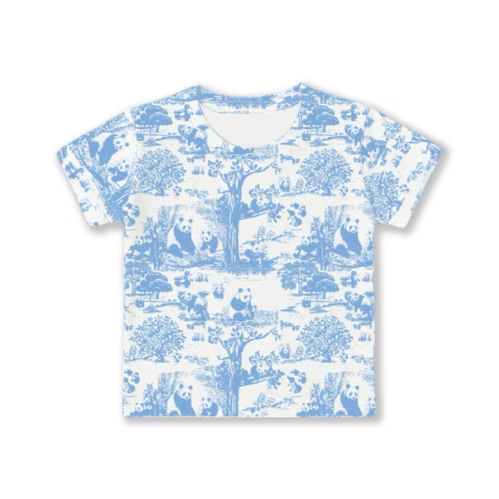 White bamboo kids pyjama t-shirt with blue panda and tree pattern on a white background — soft, breathable, eczema-friendly sleepwear.