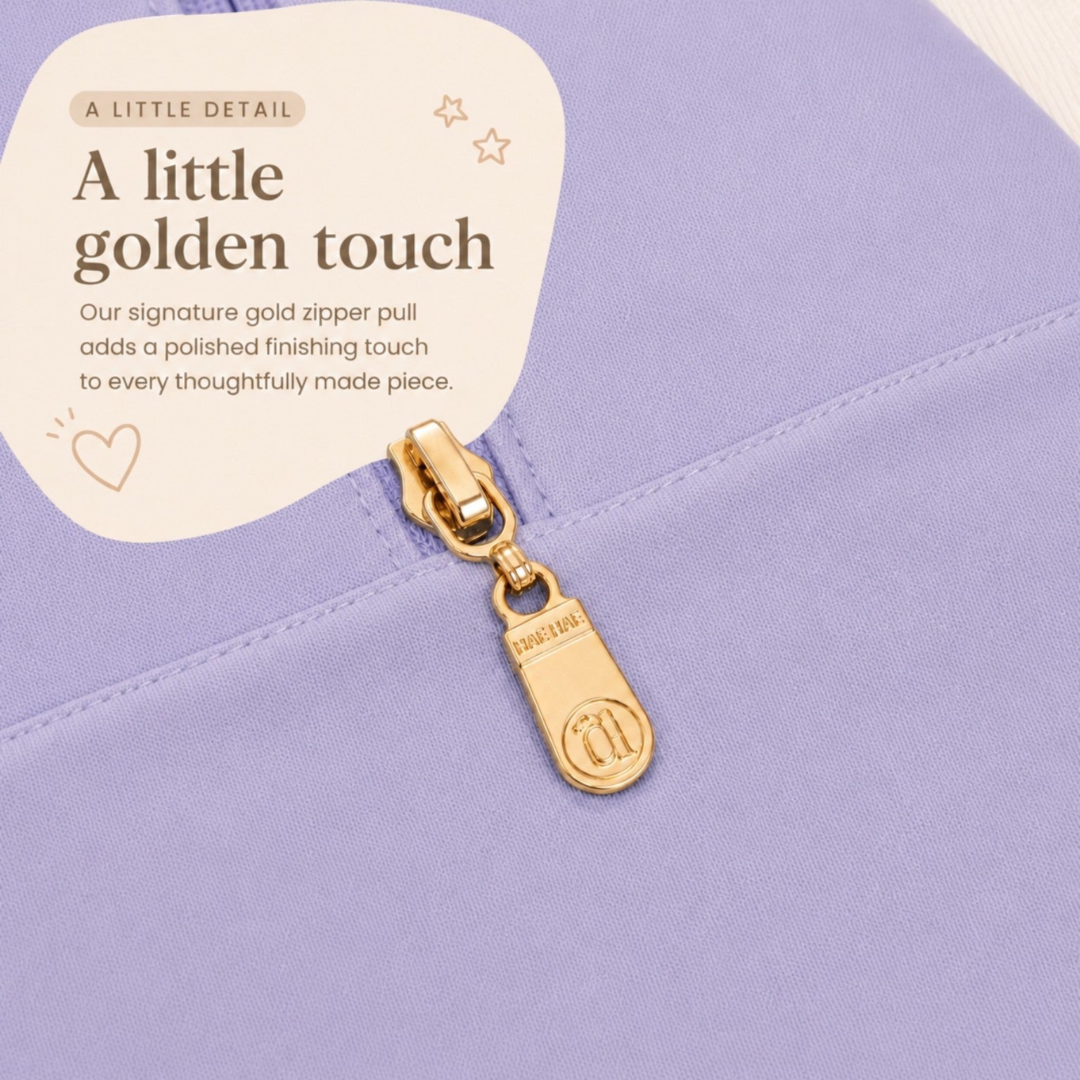 Farmer's Market signature gold Hae Hae zipper pull detail