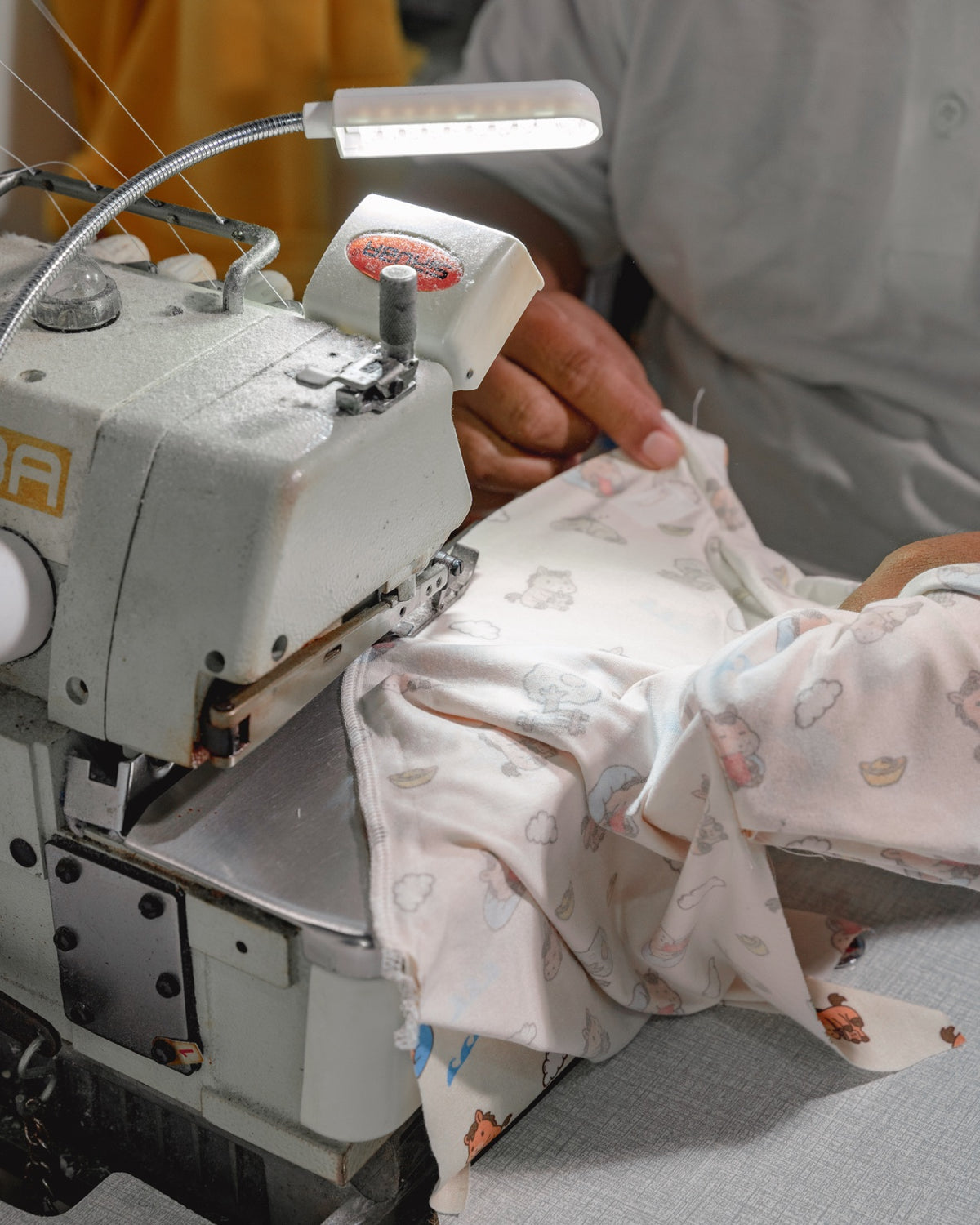 Overlock sewing process at Hae Hae production facility in Batam, Indonesia