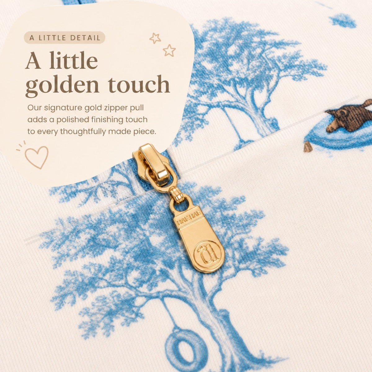 Open Meadows signature gold Hae Hae zipper pull detail