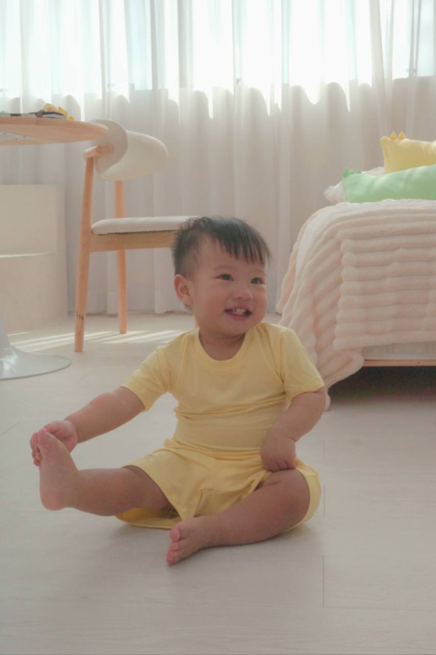 Micah wearing the yellow Farmer’s Market Short-Sleeve Set